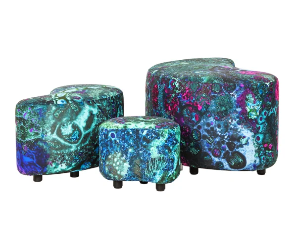 Collection of ALKIO, TUMA, and TUMA-P Mini furniture pieces adorned with Palad’s vibrant ART Collection Evolution textile, showcasing a mesmerizing blend of cosmic blues, greens, and purples.